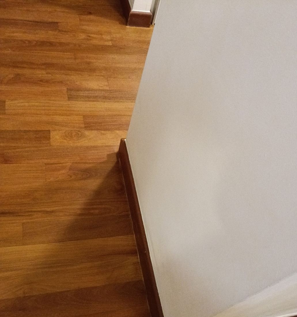 Close-up of refinished teak strips in a condo