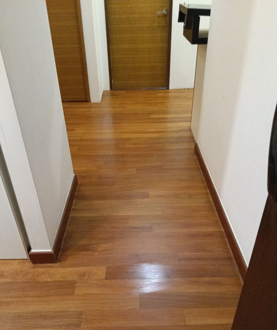 Medium oak strip floor in an apartment corridor