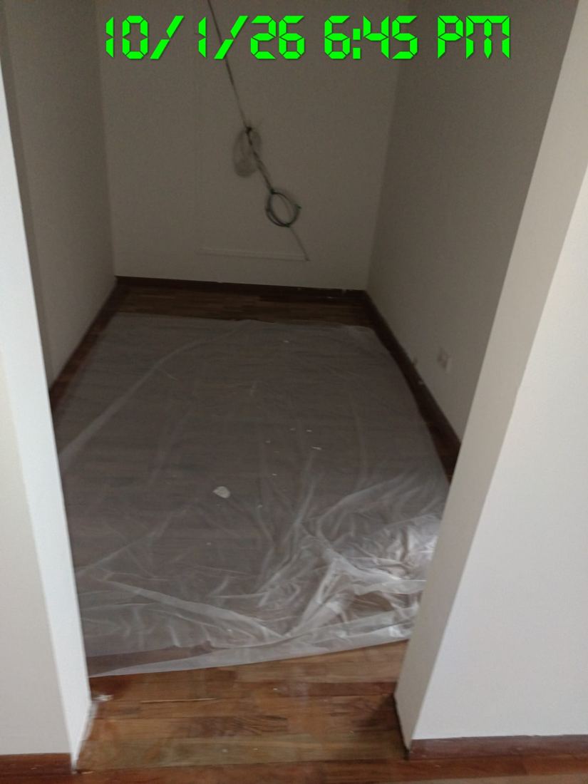 Finished room covered with plastic sheeting to protect it
