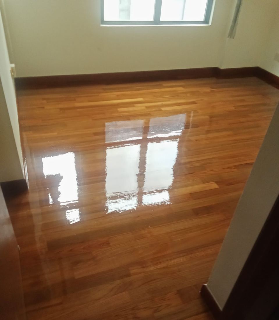 High-gloss teak strip parquet in an HDB bedroom